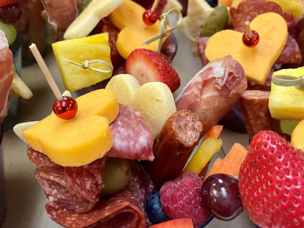 Charcuterie in cups with cheese hearts horiz