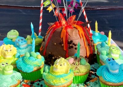 Dinosaur cake and cupcakes